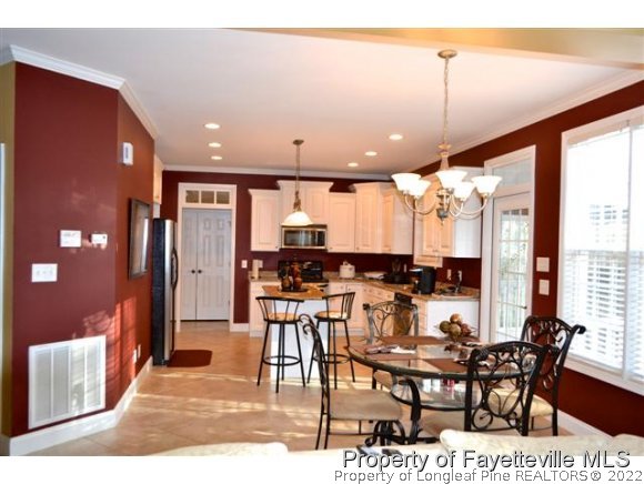 95 Falling Water Road Spring Lake, NC 28390 - Photo 9 of 20 a large kitchen with a table and chairs