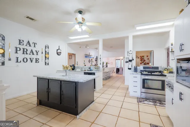 a view of living room with granite countertop furniture and a potted plant