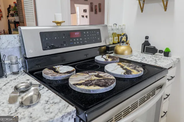 a utility room with sink dryer and washer