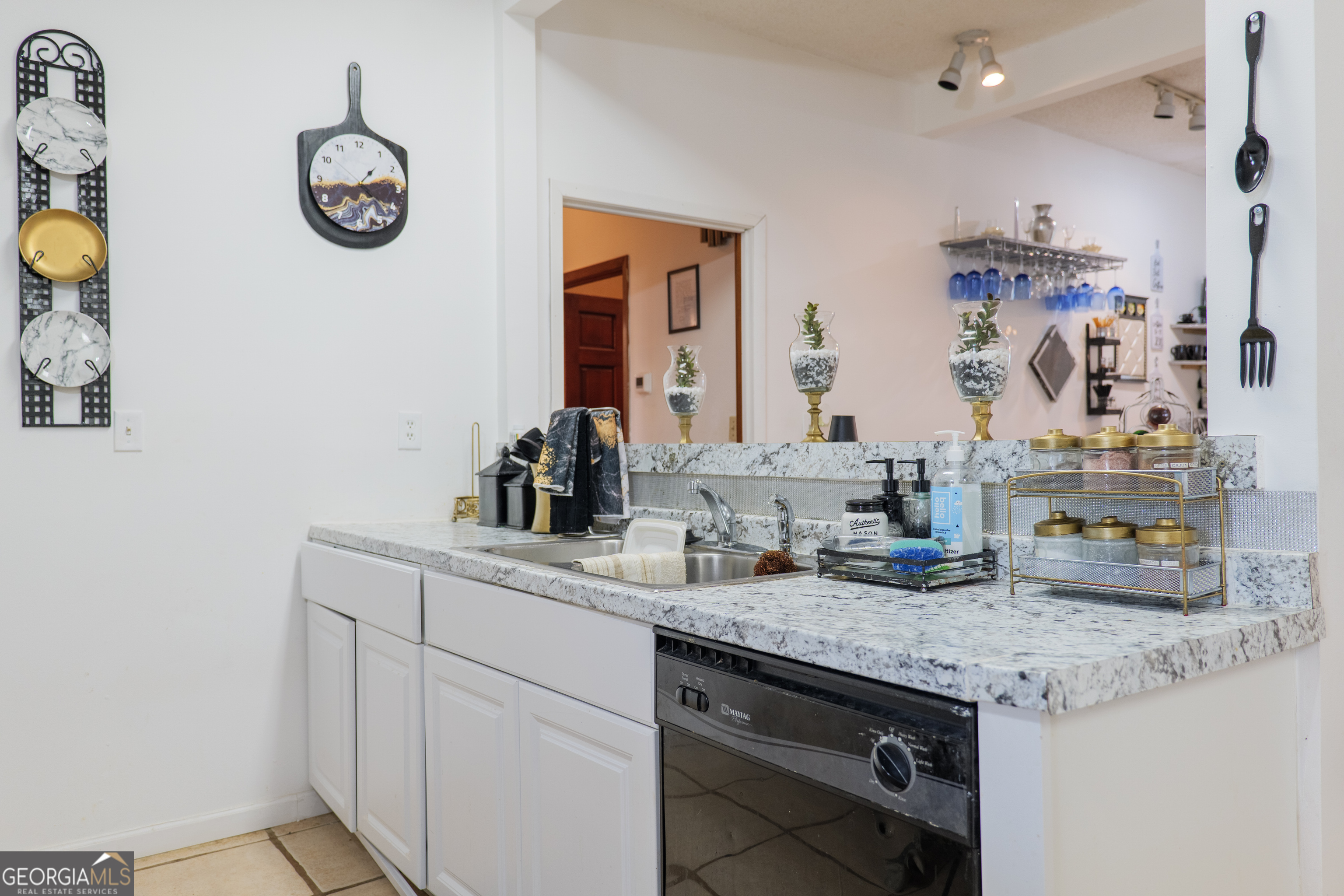 3473 Kay Circle Valdosta, GA 31606 - Photo 19 of 79 a bathroom with a granite countertop sink and a mirror