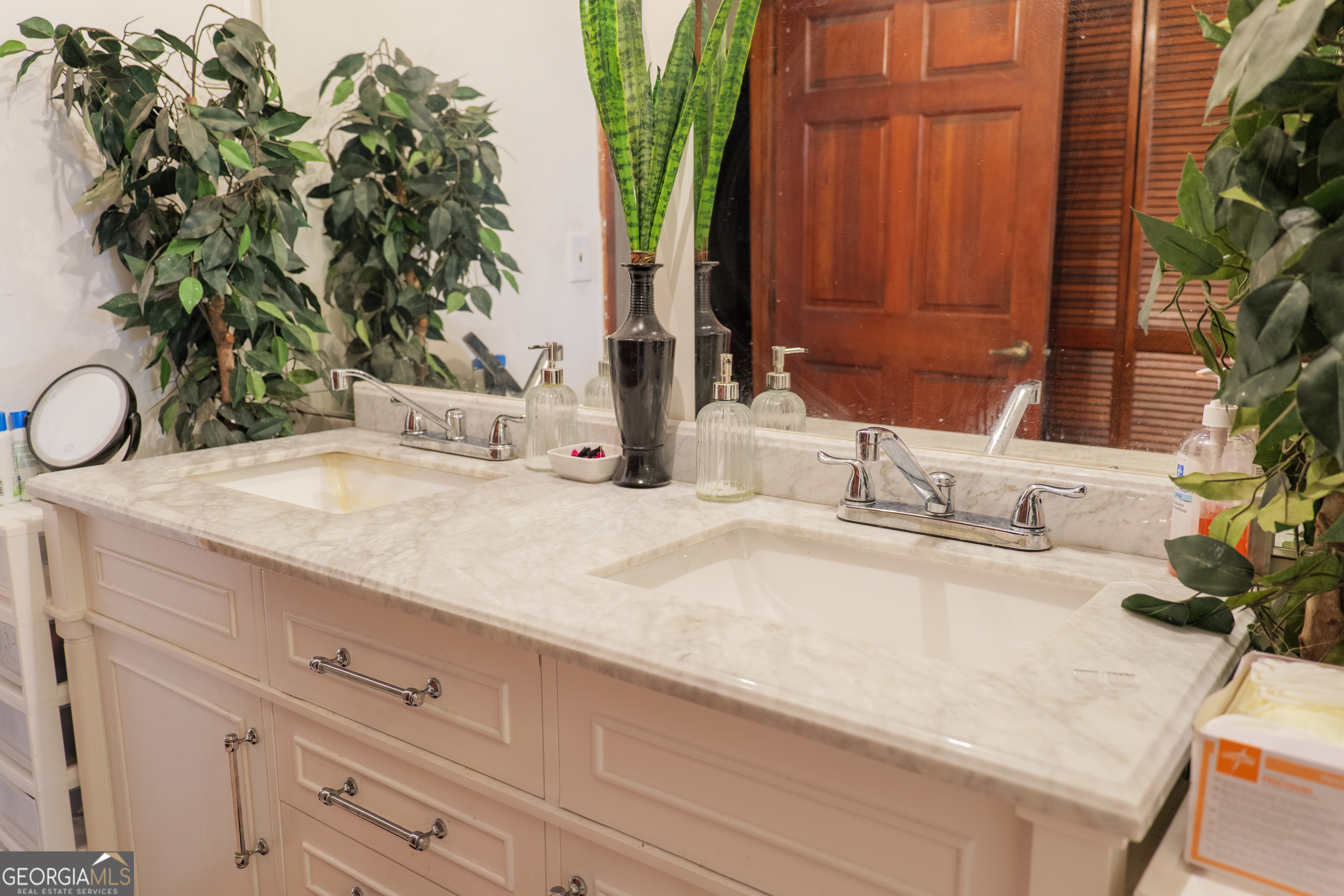 3473 Kay Circle Valdosta, GA 31606 - Photo 41 of 79 a bathroom with a sink and a mirror