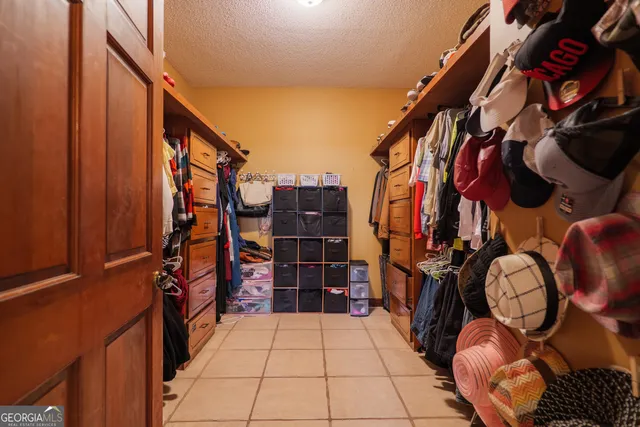 a view of a house with a wooden fence