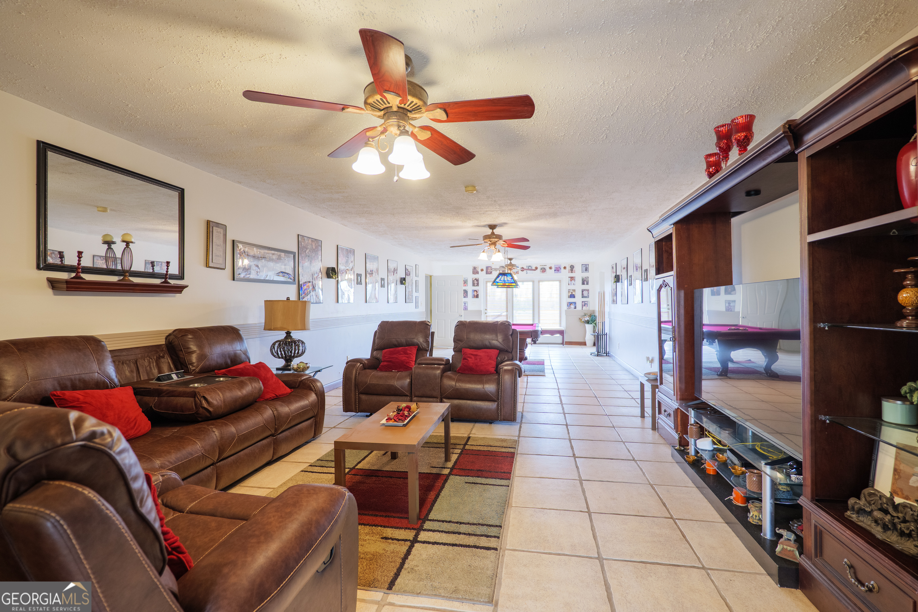 3473 Kay Circle Valdosta, GA 31606 - Photo 62 of 79 a living room with furniture and a flat screen tv