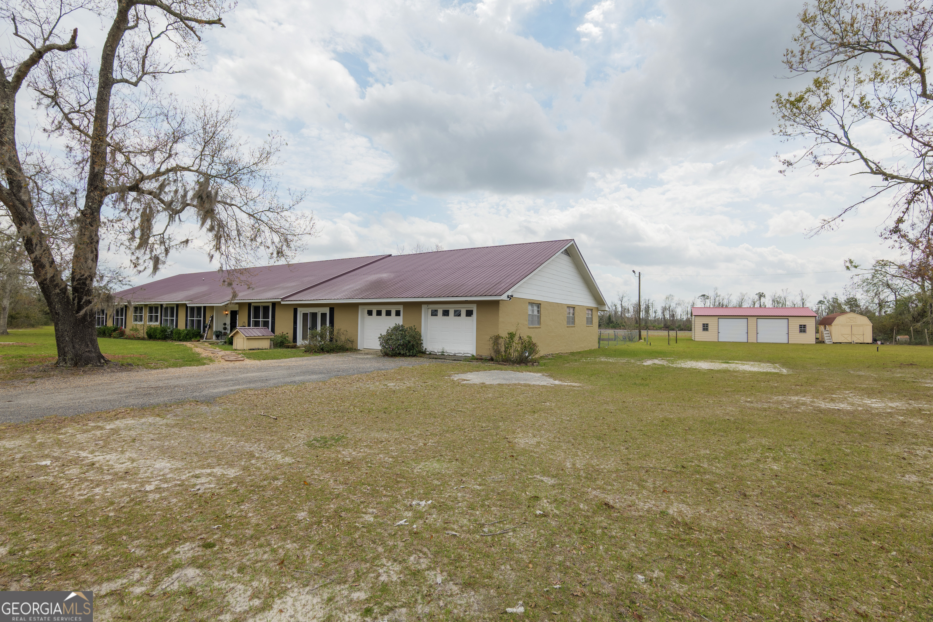 3473 Kay Circle Valdosta, GA 31606 - Photo 72 of 79 a view of a house with a big yard and large trees