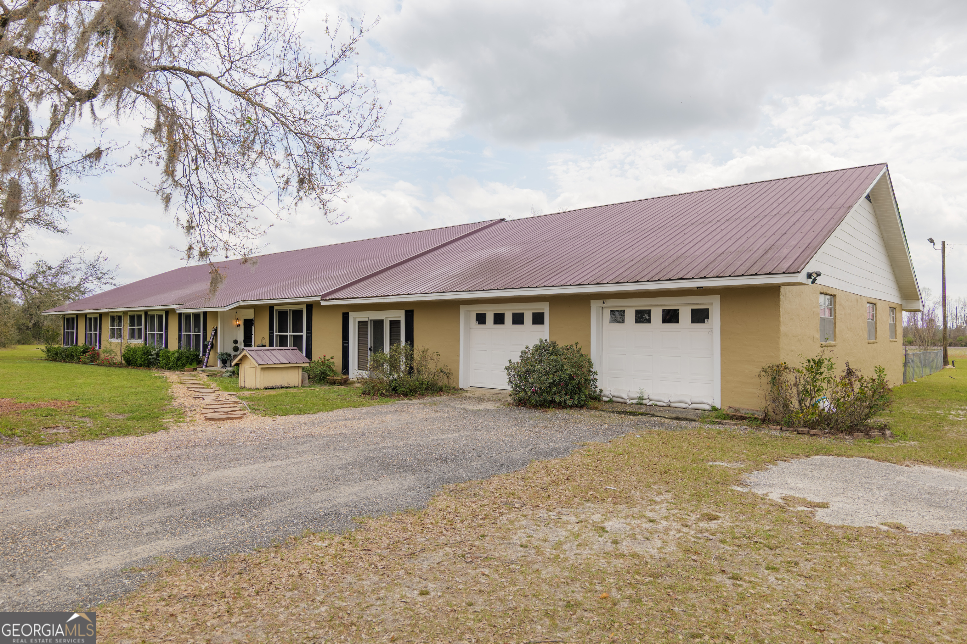 3473 Kay Circle Valdosta, GA 31606 - Photo 73 of 79 a front view of a house with a yard and garage