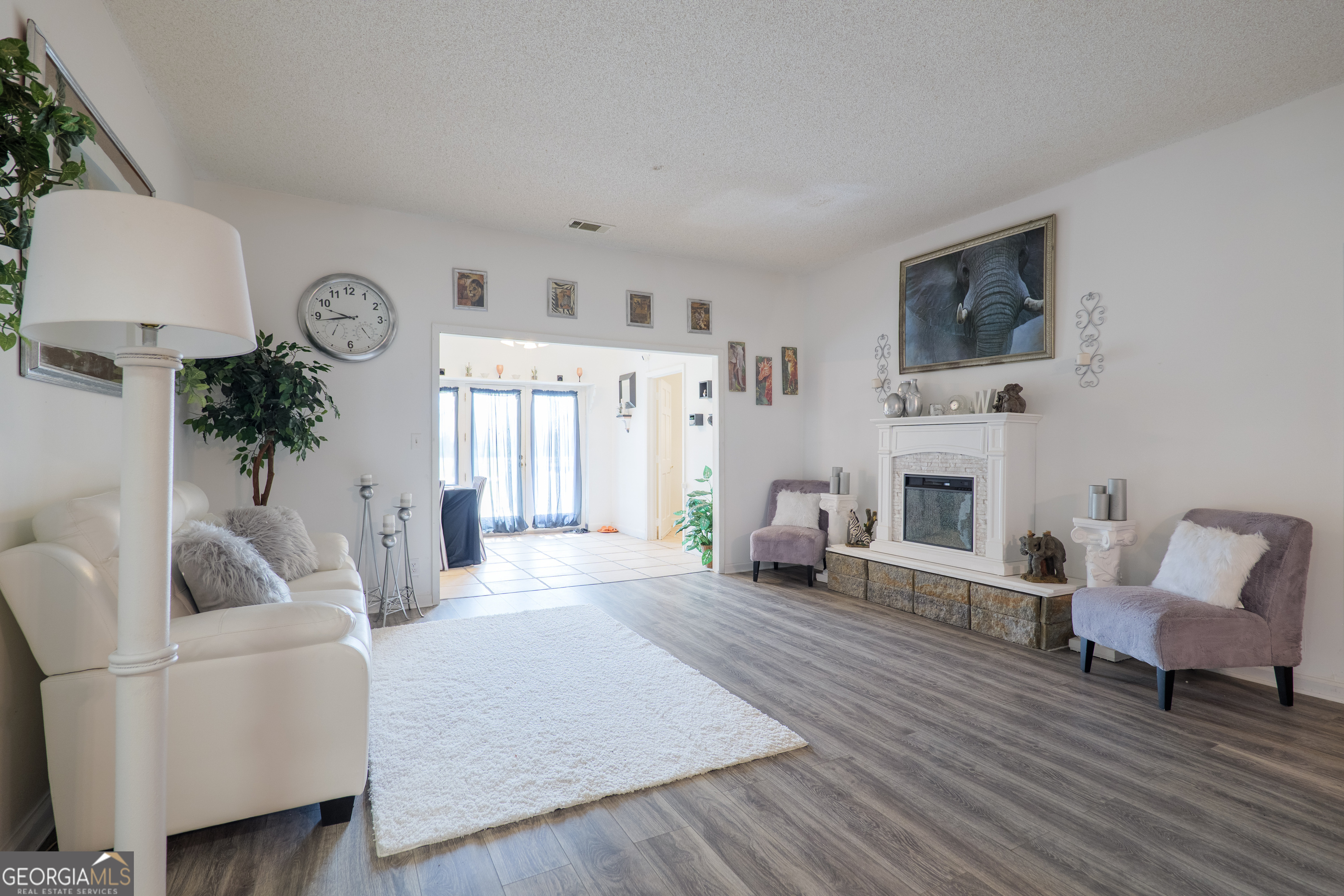 3473 Kay Circle Valdosta, GA 31606 - Photo 9 of 79 a living room with furniture a fireplace and a flat screen tv