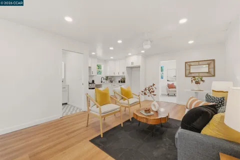 a kitchen with a stove and a white cabinet