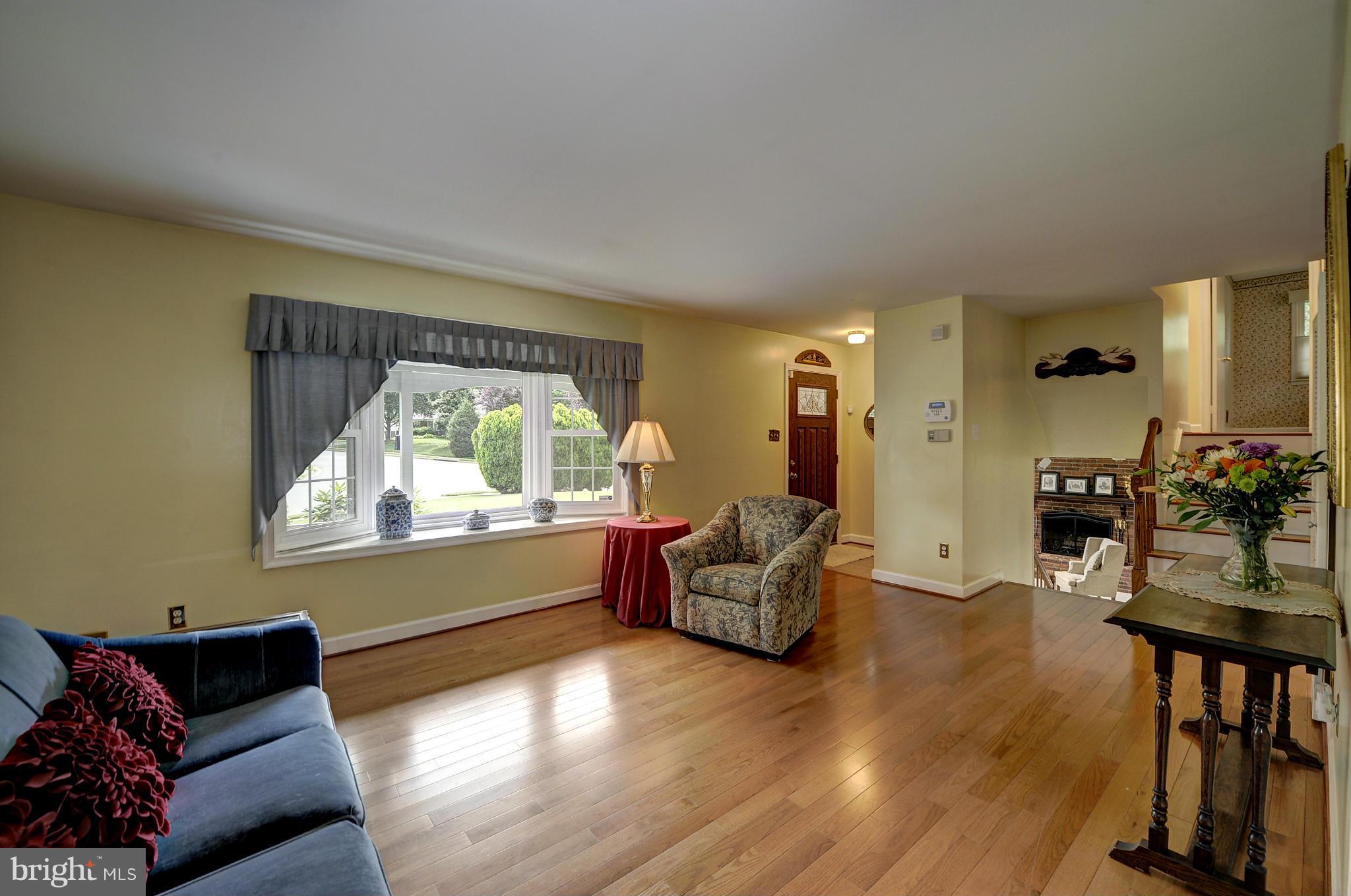 8609 Woodview Drive Springfield, VA 22153 - Photo 11 of 28 a living room with furniture and a large window