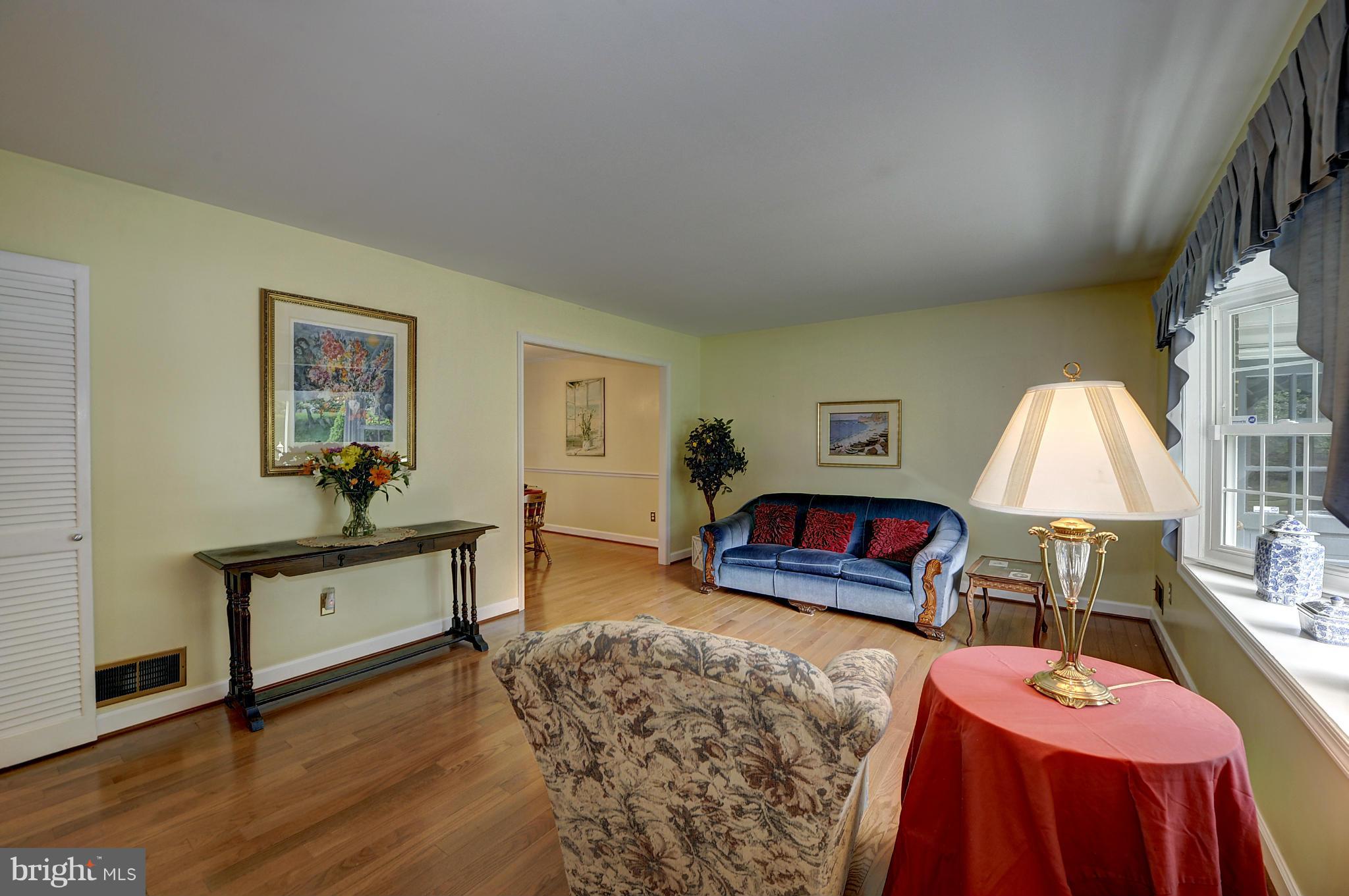 8609 Woodview Drive Springfield, VA 22153 - Photo 8 of 28 a bedroom with furniture and a wooden floor