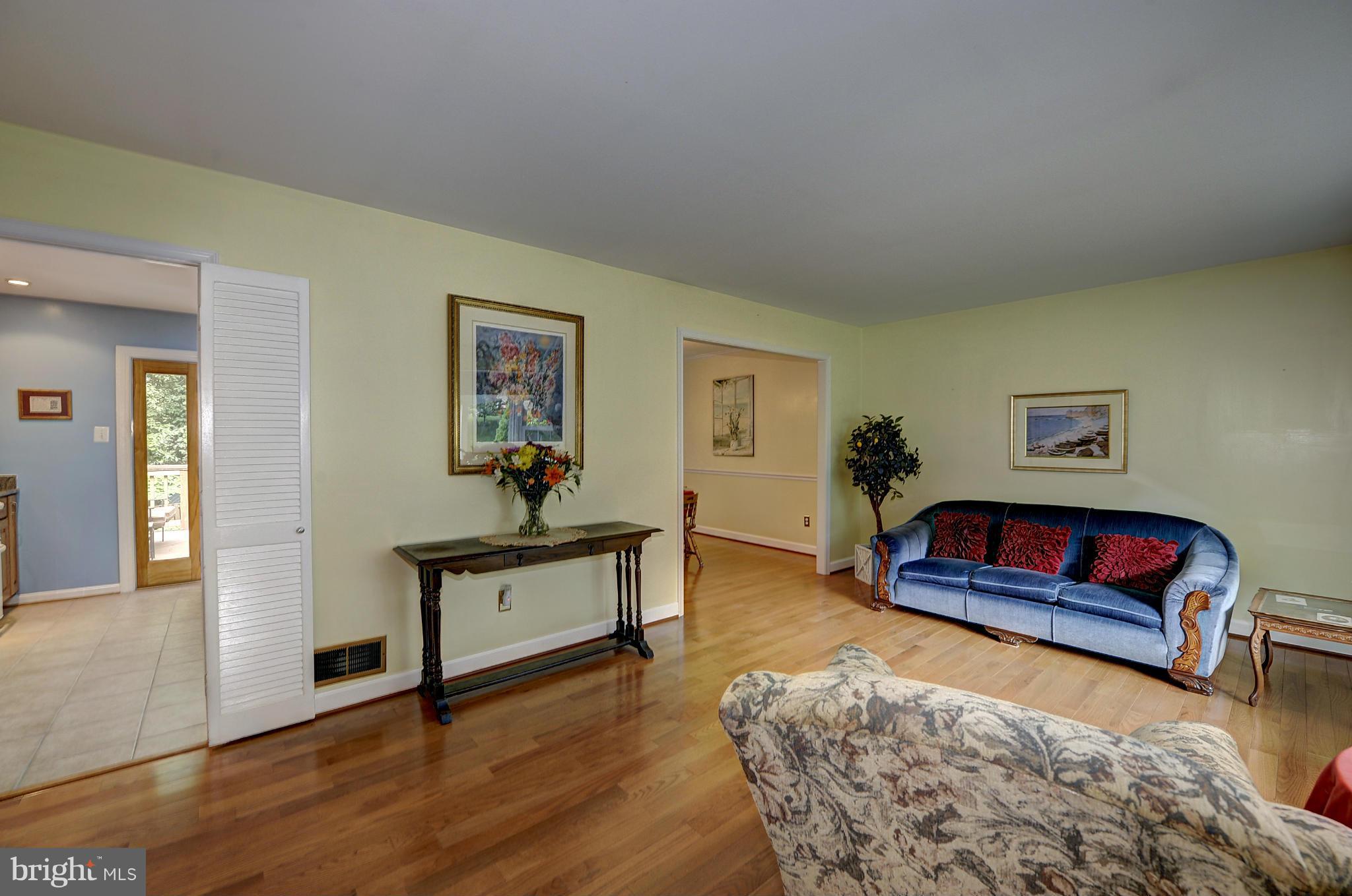 8609 Woodview Drive Springfield, VA 22153 - Photo 9 of 28 a living room with furniture and wooden floor