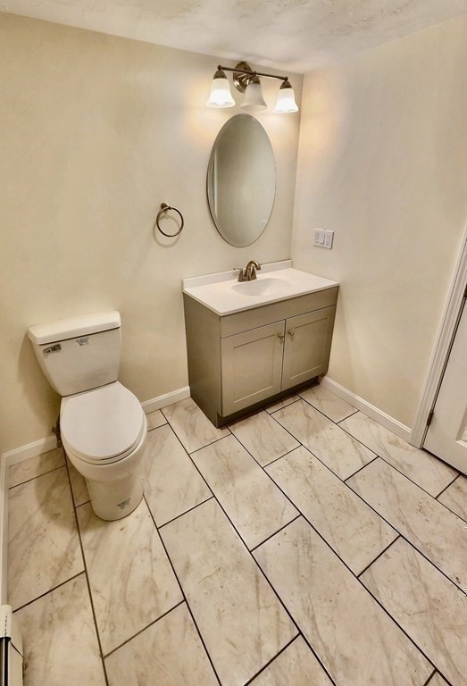 76 Bradley Rd Extension Braintree, MA 02184 - Photo 15 of 19 a bathroom with a sink mirror vanity and toilet