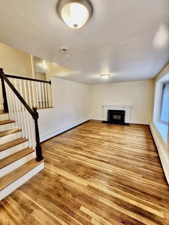 76 Bradley Rd Extension Braintree, MA 02184 - Photo 4 of 19 a view of empty room with wooden floor