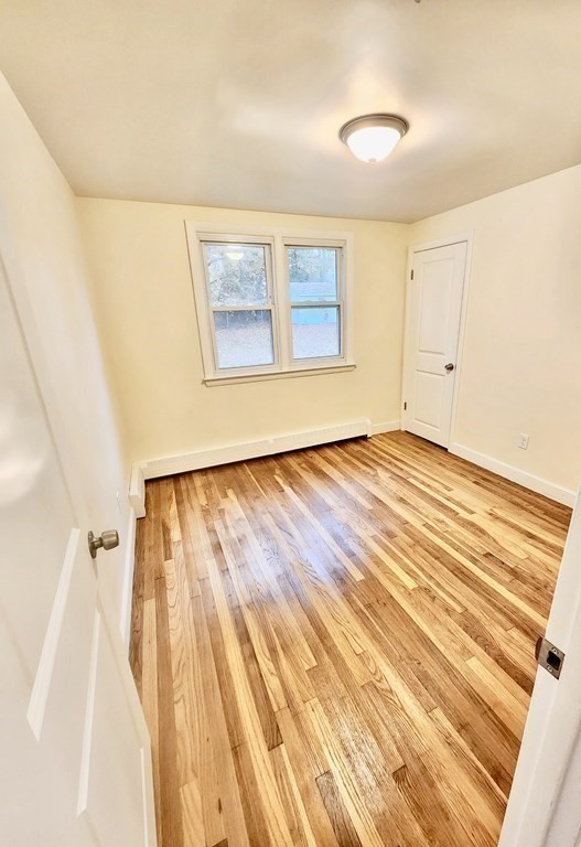 76 Bradley Rd Extension Braintree, MA 02184 - Photo 9 of 19 a view of an empty room with a window