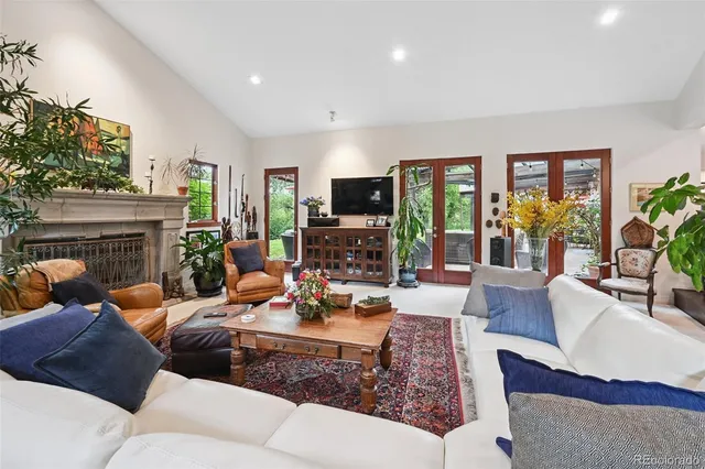 a view of a dining room with furniture and a chandelier