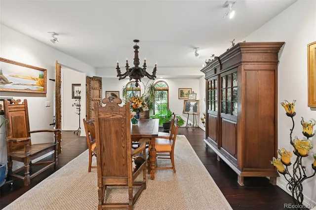 a spacious bedroom with a bed and a large mirror