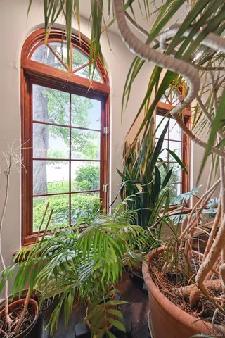 a dining room with furniture and wooden floor