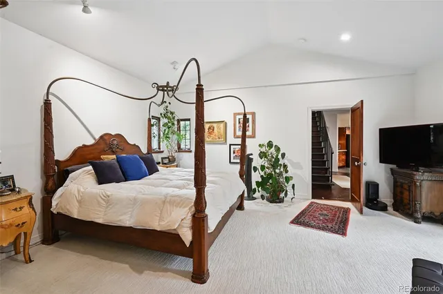 a bedroom with furniture and a fireplace