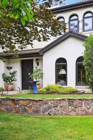 a front view of a house with garden
