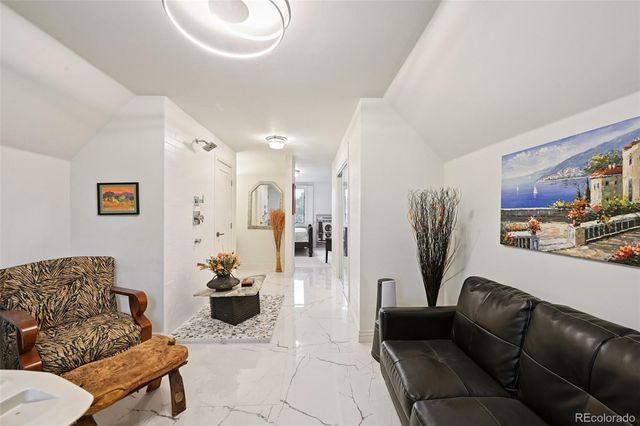 a bedroom with a bed and a fireplace