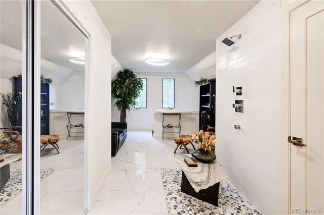 a bathroom with a sink mirror toilet and bathtub