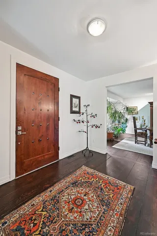 a kitchen with stainless steel appliances kitchen island granite countertop a sink and cabinets