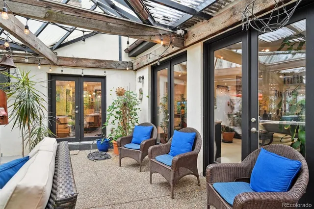 a view of a house with a yard porch and sitting area