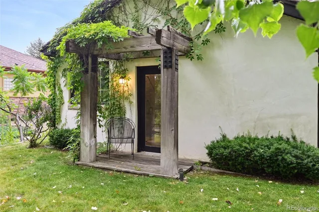 a view of a house with a yard porch and sitting area