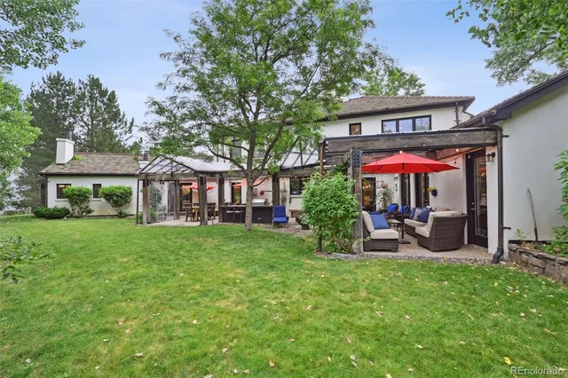 an aerial view of a house with garden space and street view