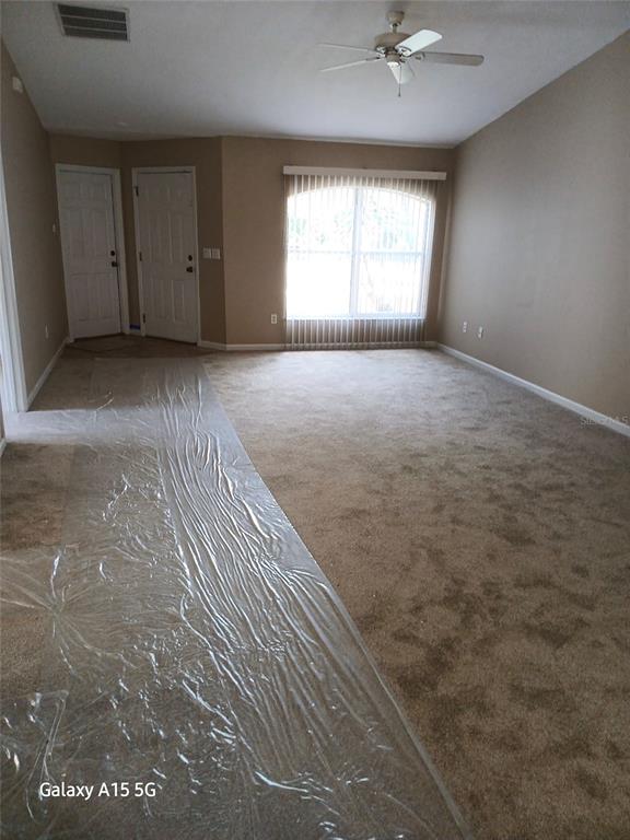 28 Plateau Lane, Unit B Palm Coast, FL 32164 - Photo 2 of 7 an empty room with a window