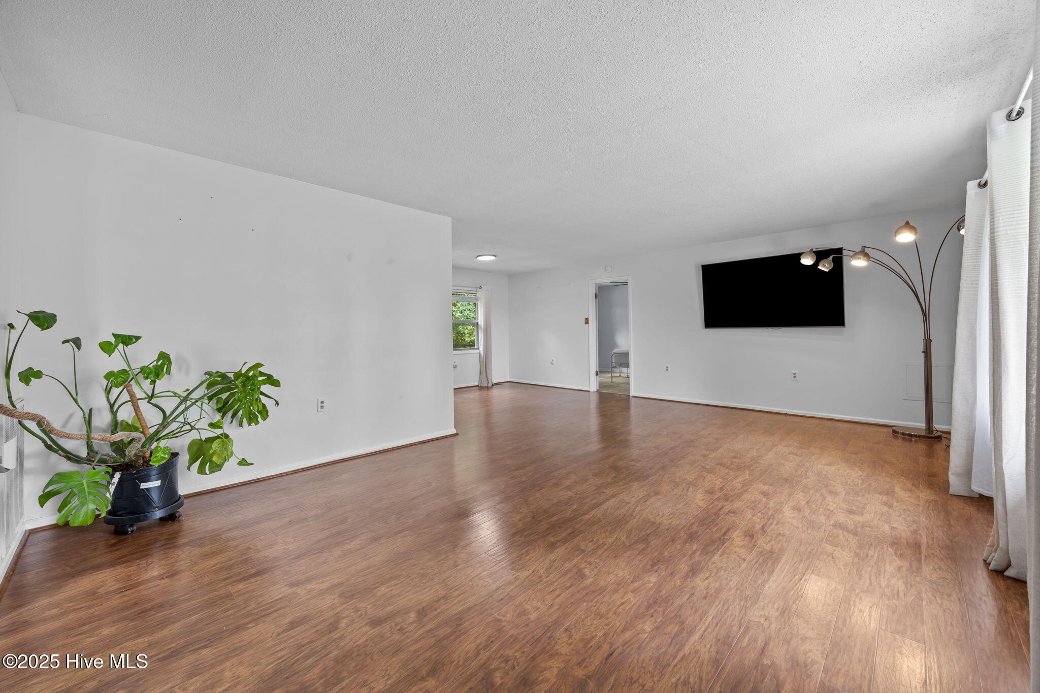 1413 Bud Hawkins Road Dunn, NC 28334 - Photo 15 of 56 Living room is great for space and large bay window.