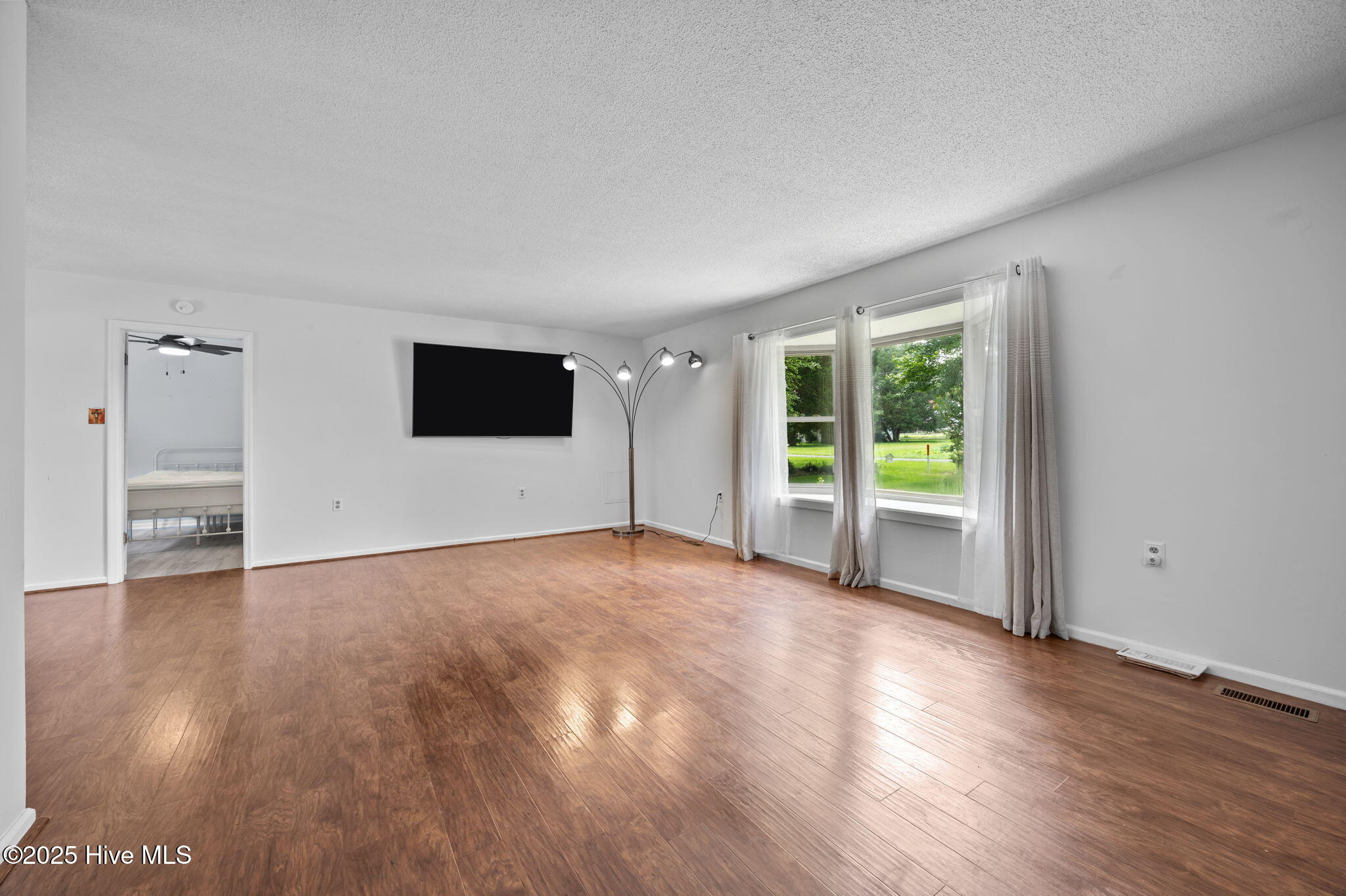 1413 Bud Hawkins Road Dunn, NC 28334 - Photo 16 of 56 Spacious living room with large window.