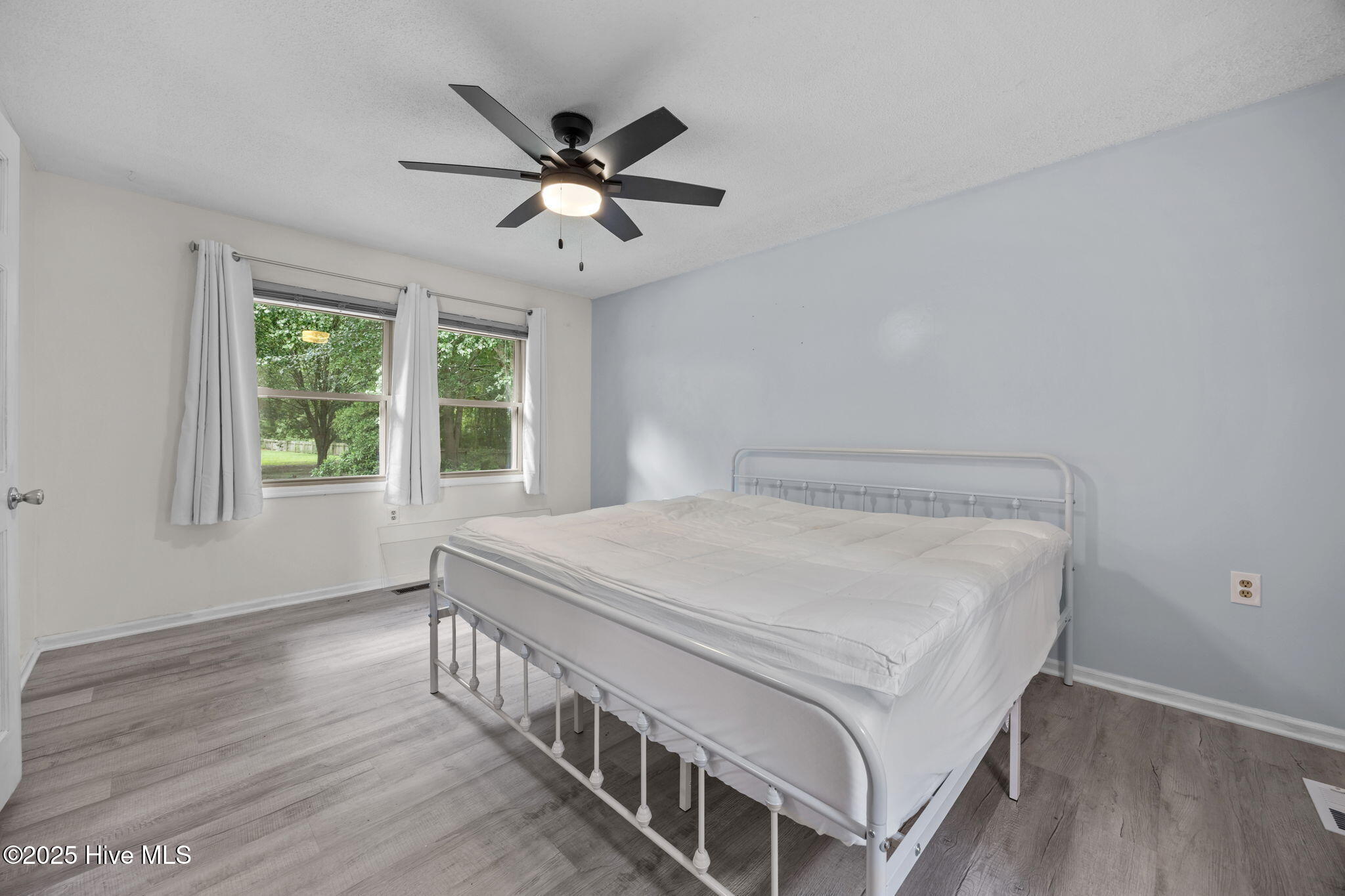 1413 Bud Hawkins Road Dunn, NC 28334 - Photo 28 of 56 Owner's Suite and nice window view of beautifu grounds.