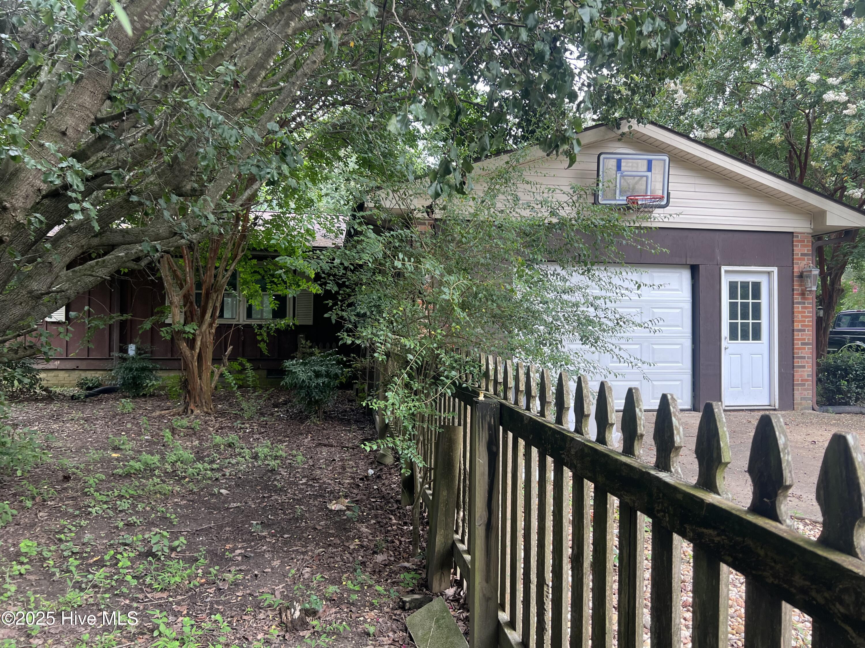 1413 Bud Hawkins Road Dunn, NC 28334 - Photo 41 of 56 The side entry garage and doorway is a nice feature...