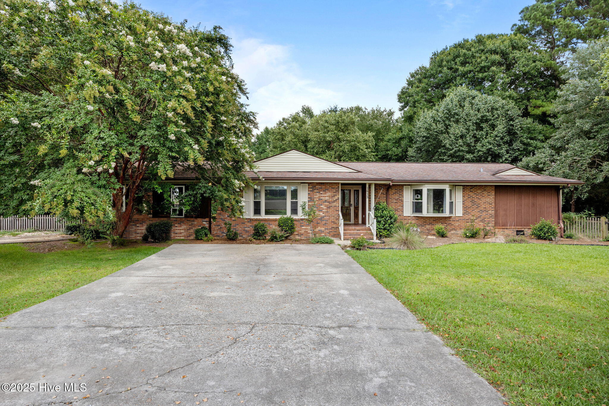 1413 Bud Hawkins Road Dunn, NC 28334 - Photo 8 of 56 Home has 2 concrete driveways with side entry garage.