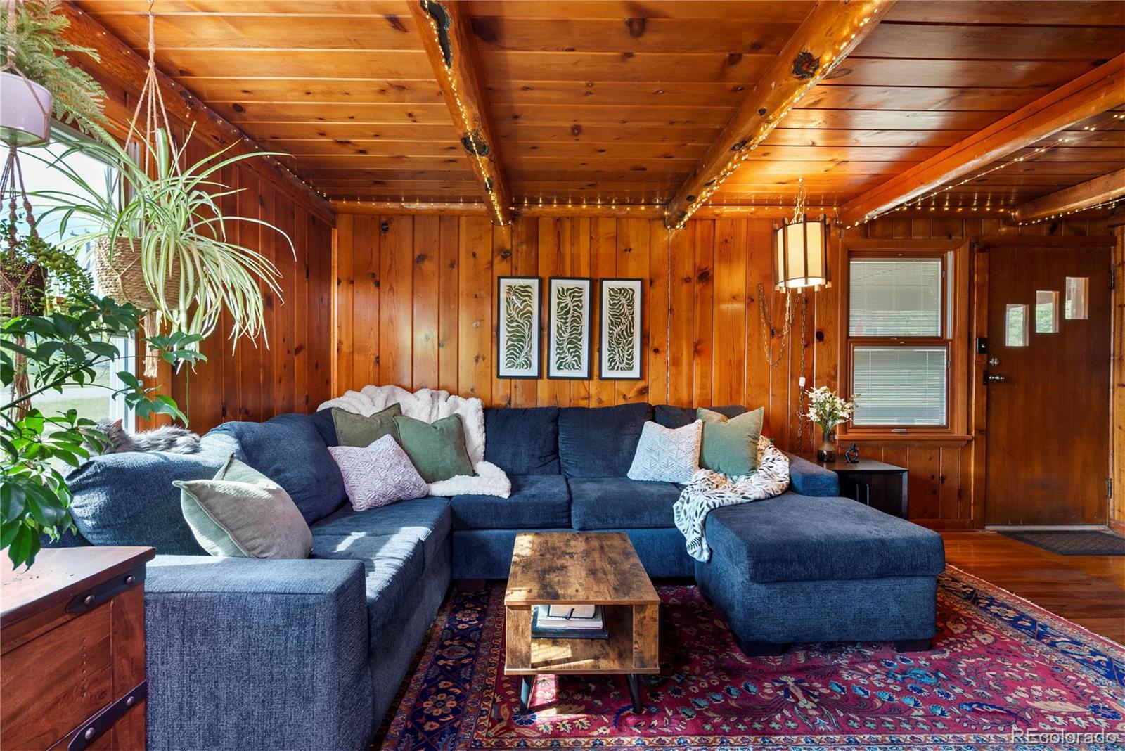 21852 Pleasant Park Road Conifer, CO 80433 - Photo 11 of 47 a outdoor living space with furniture and a potted plant