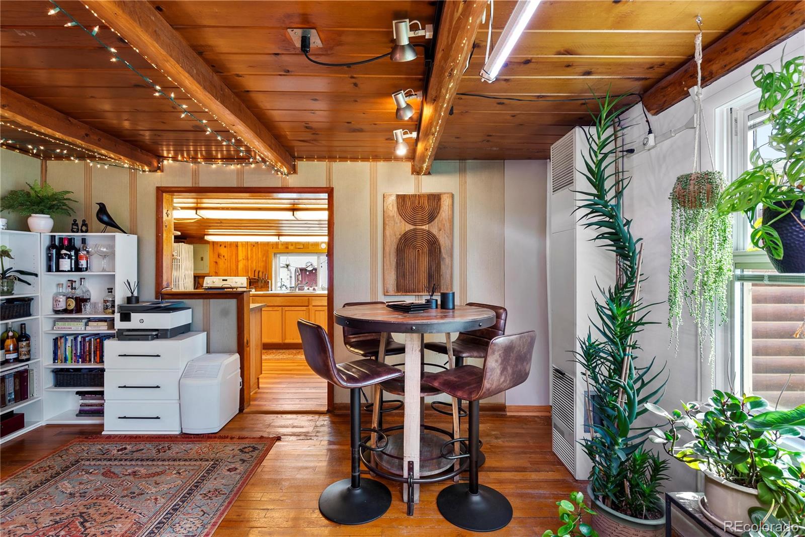 21852 Pleasant Park Road Conifer, CO 80433 - Photo 15 of 47 a dining room with furniture and a potted plant