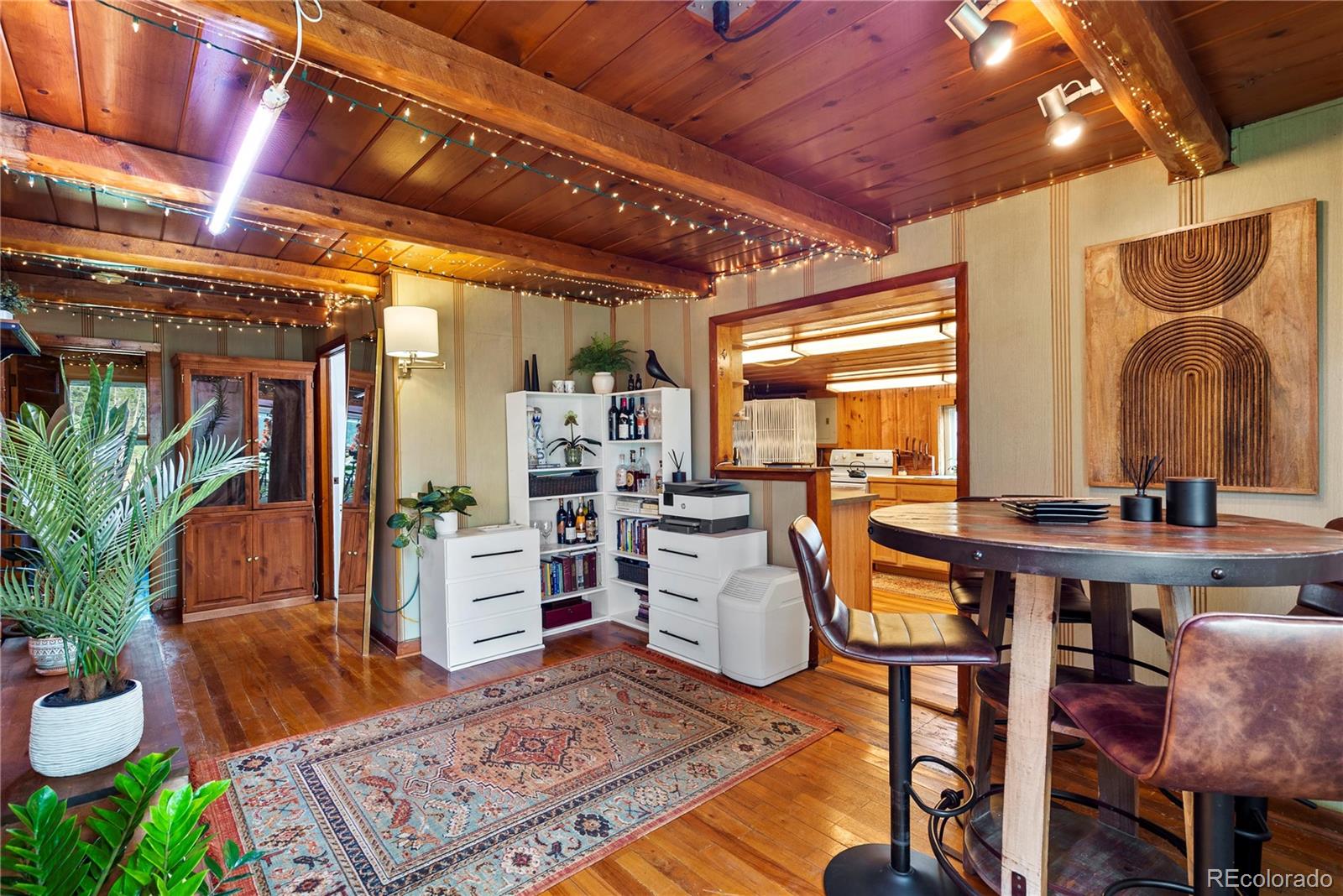 21852 Pleasant Park Road Conifer, CO 80433 - Photo 16 of 47 a living room with furniture and a potted plant