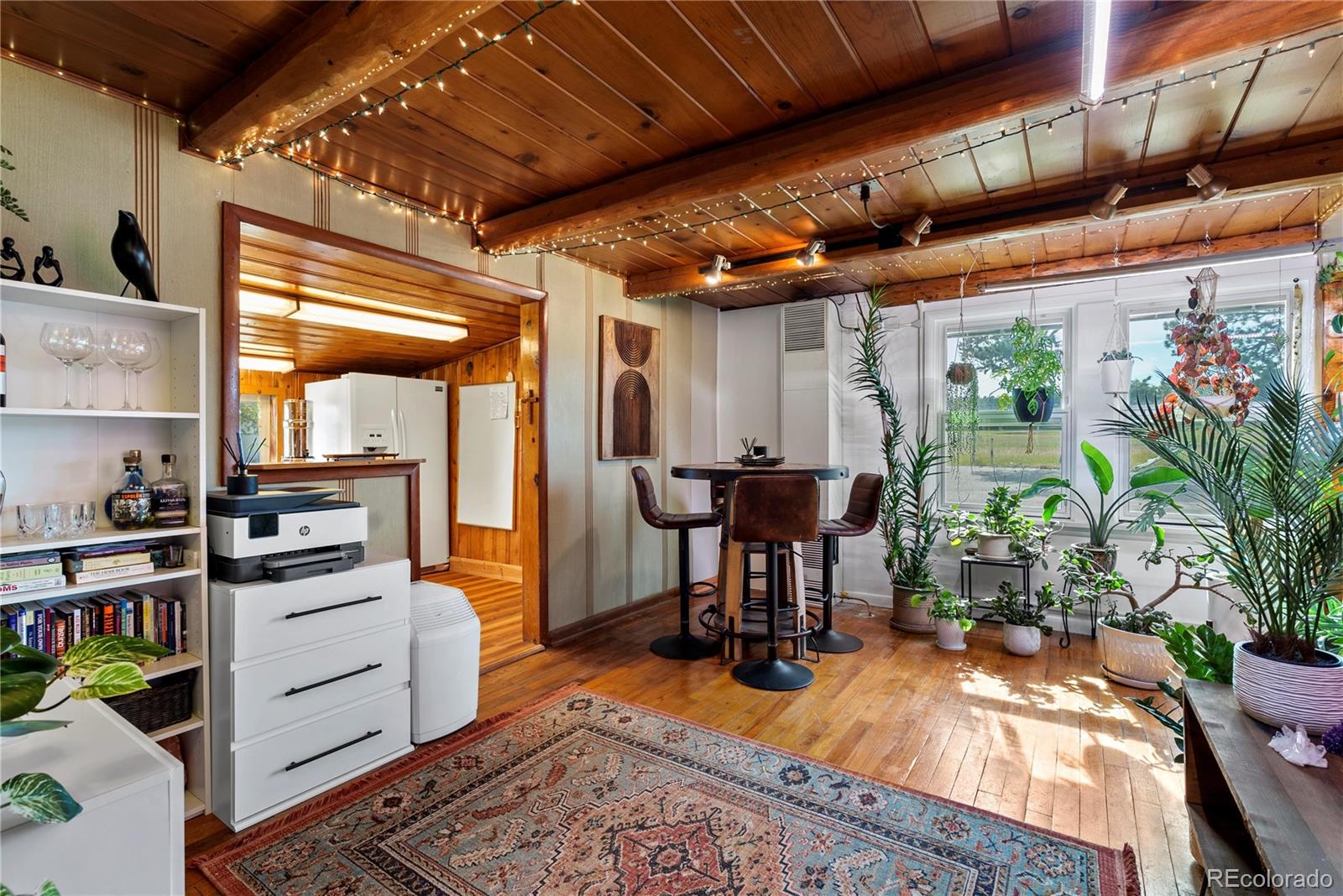21852 Pleasant Park Road Conifer, CO 80433 - Photo 17 of 47 a view of a kitchen with furniture and a window
