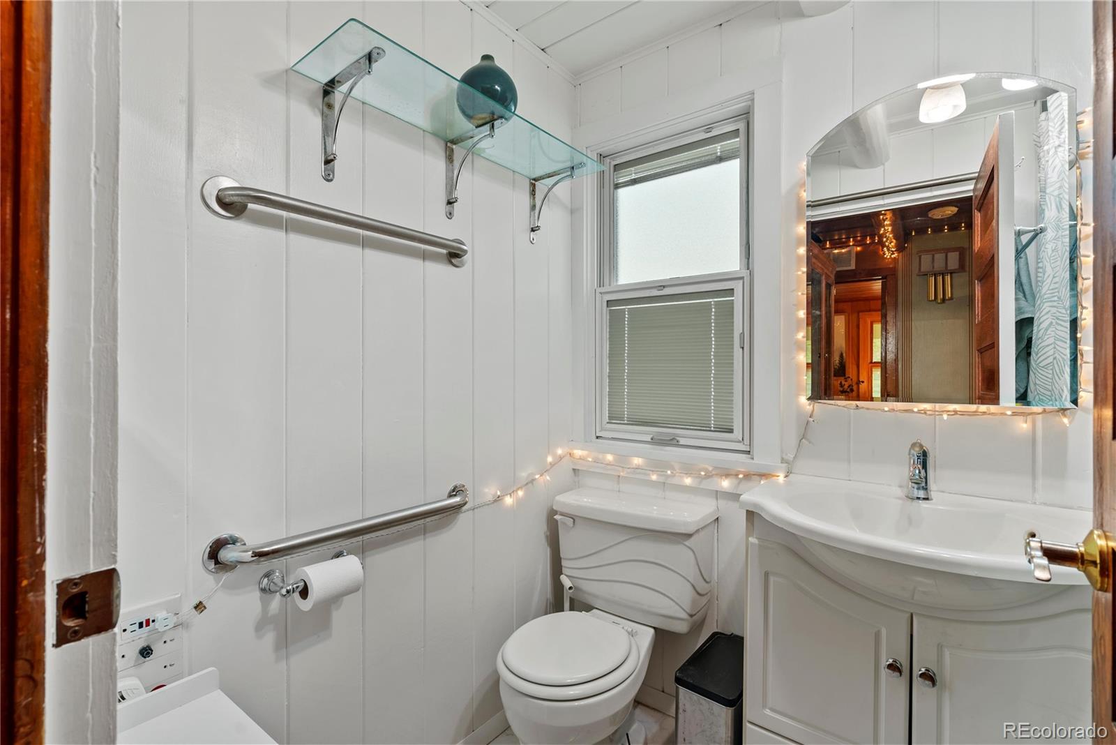 21852 Pleasant Park Road Conifer, CO 80433 - Photo 22 of 47 a bathroom with a sink toilet and shower