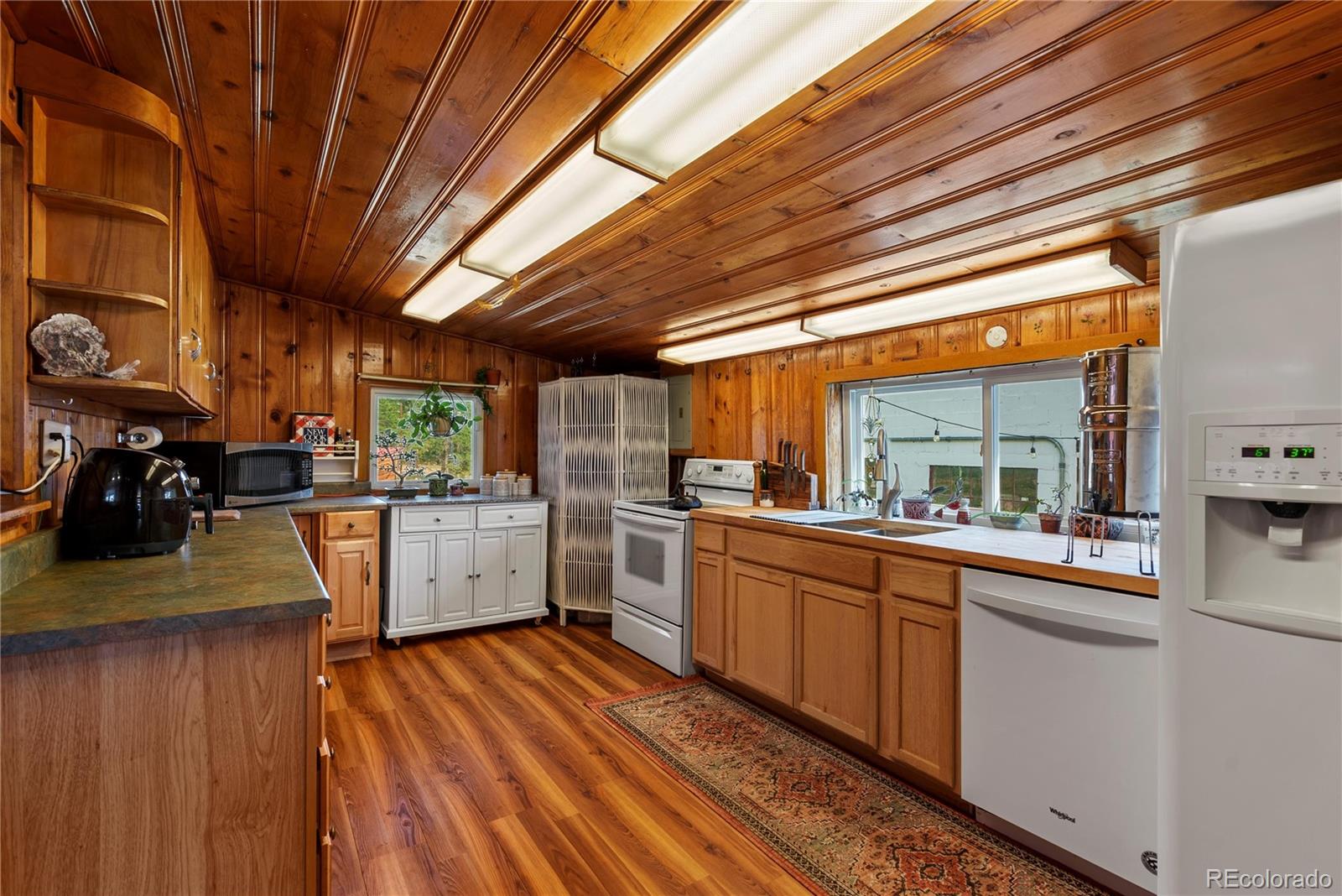 21852 Pleasant Park Road Conifer, CO 80433 - Photo 25 of 47 a kitchen with lots of counter top space and appliances