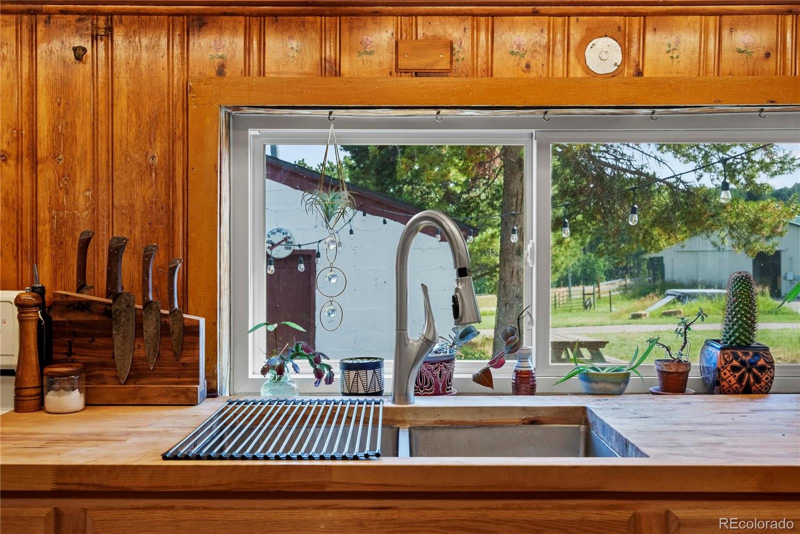 21852 Pleasant Park Road Conifer, CO 80433 - Photo 27 of 47 a view of a entryway door of the house and living room