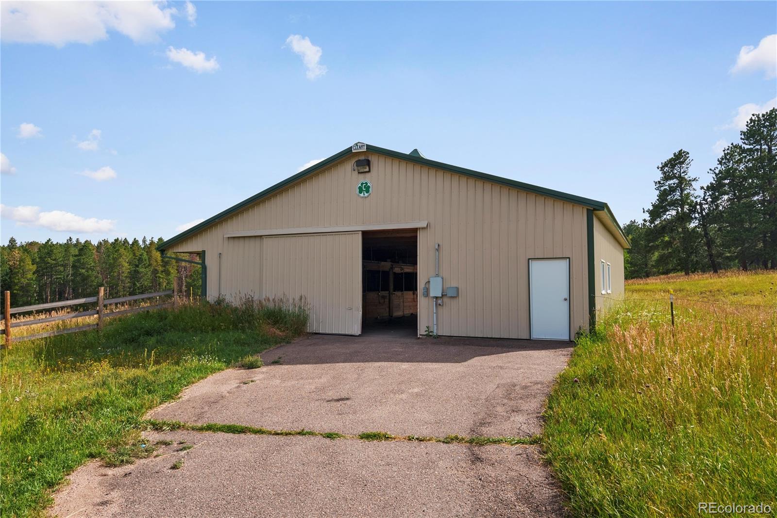21852 Pleasant Park Road Conifer, CO 80433 - Photo 32 of 47 a view of a house with backyard and garden