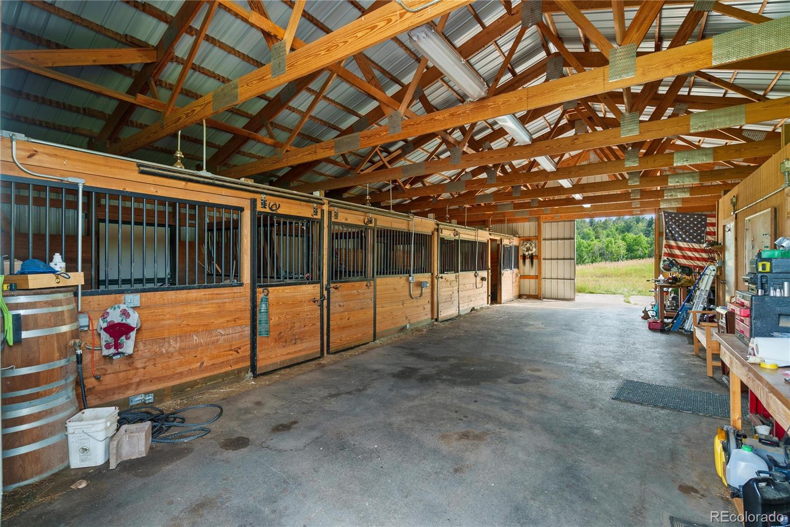 21852 Pleasant Park Road Conifer, CO 80433 - Photo 33 of 47 a view of a room with wooden floor