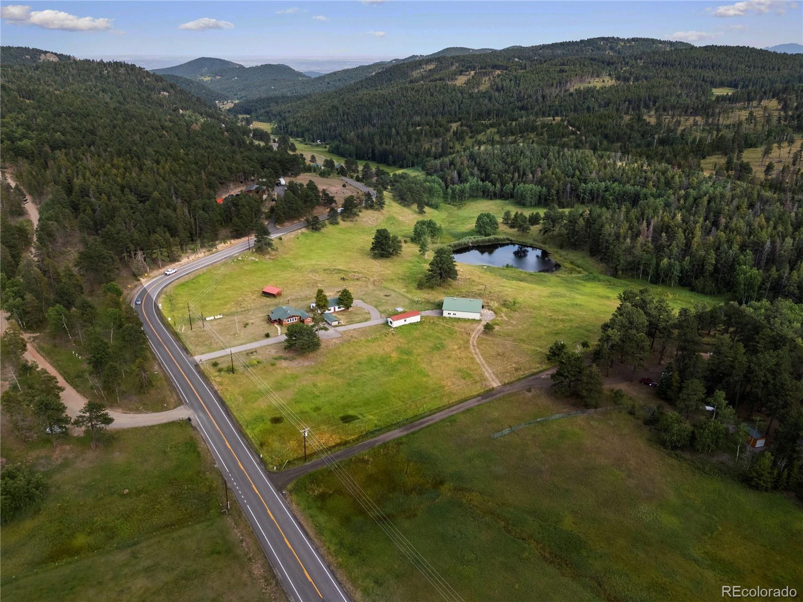 21852 Pleasant Park Road Conifer, CO 80433 - Photo 39 of 47 a view of a pool from a balcony