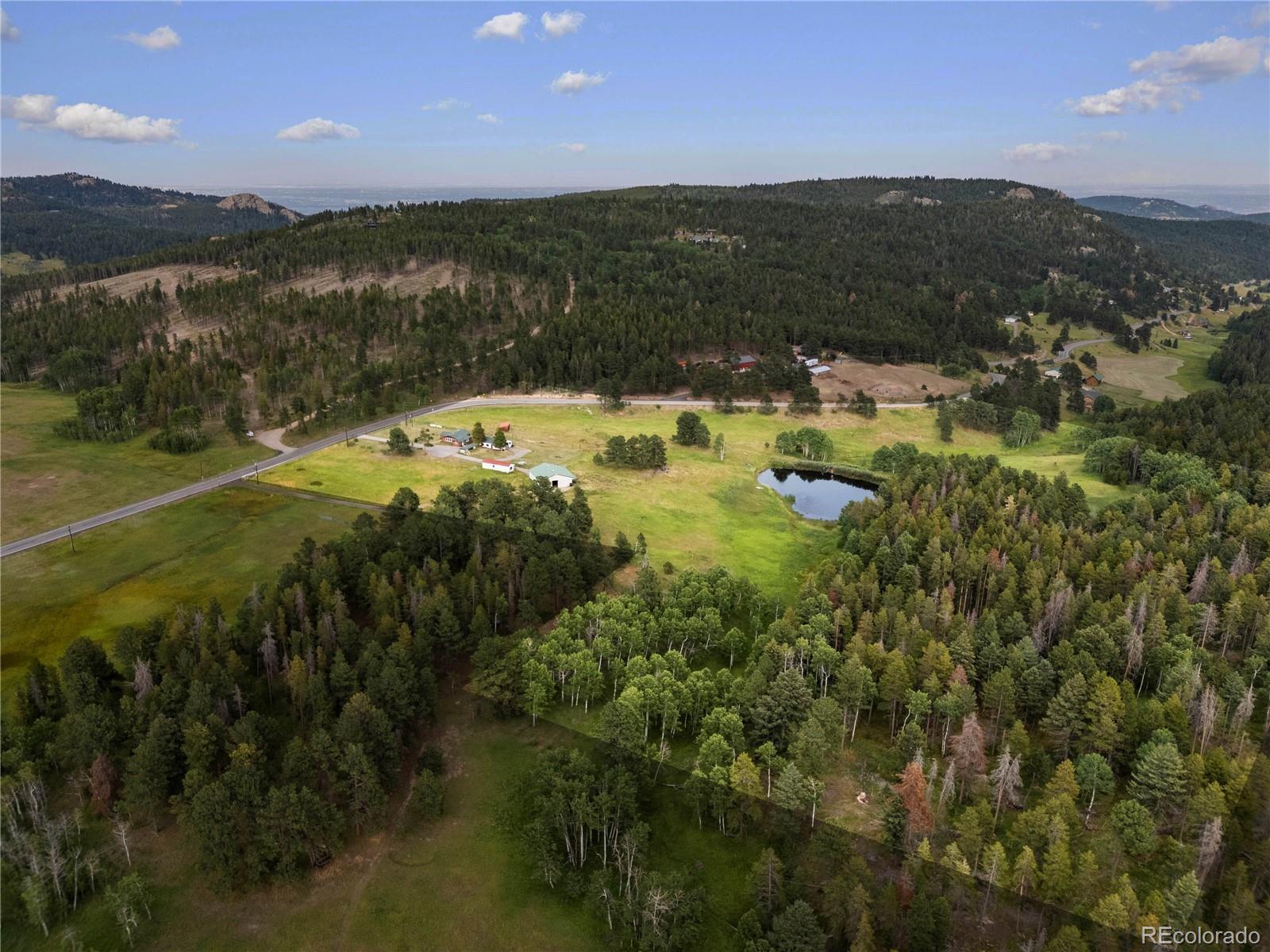 21852 Pleasant Park Road Conifer, CO 80433 - Photo 40 of 47 a view of lake and mountain