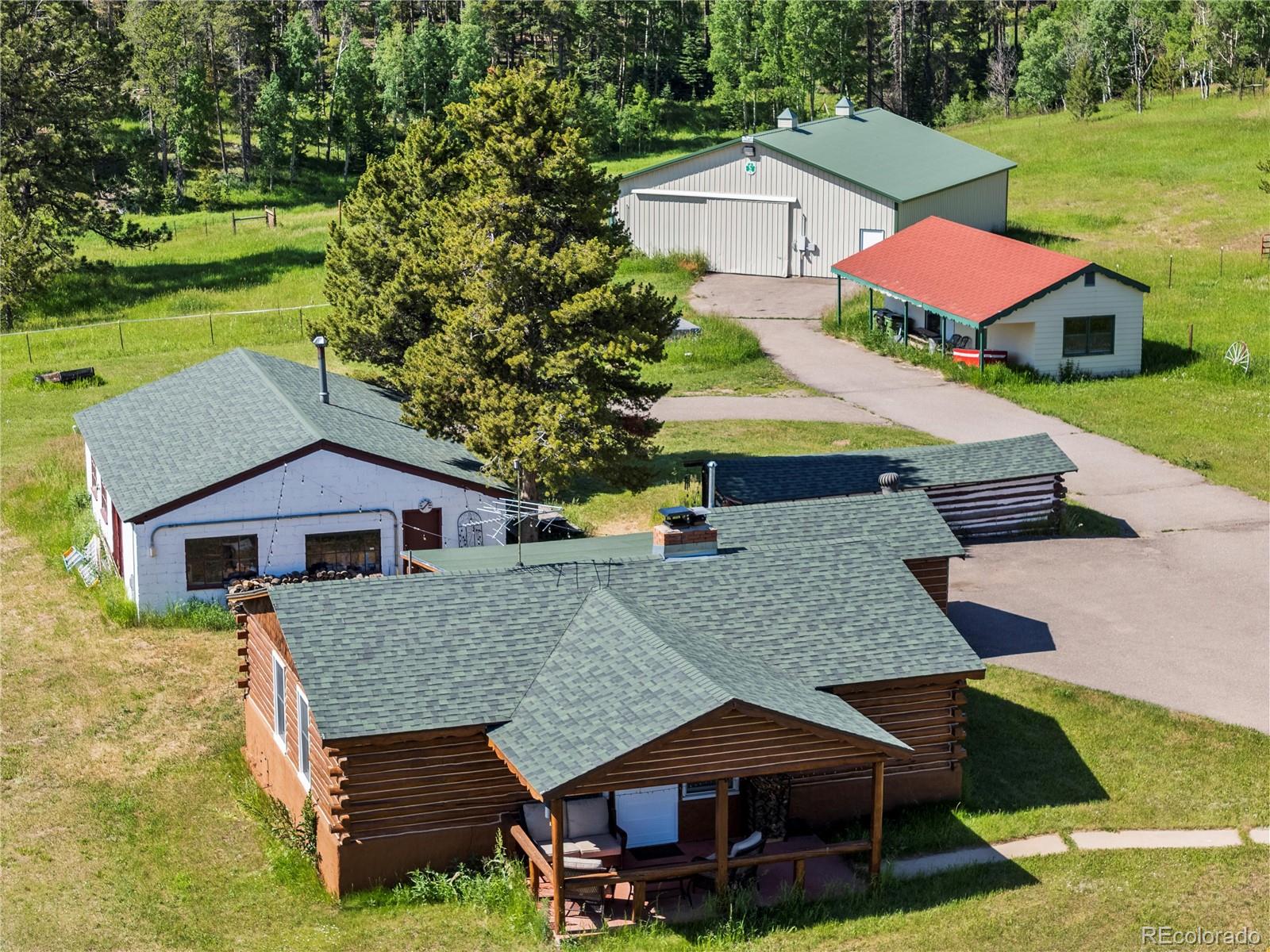 21852 Pleasant Park Road Conifer, CO 80433 - Photo 4 of 47 a aerial view of a house with a yard