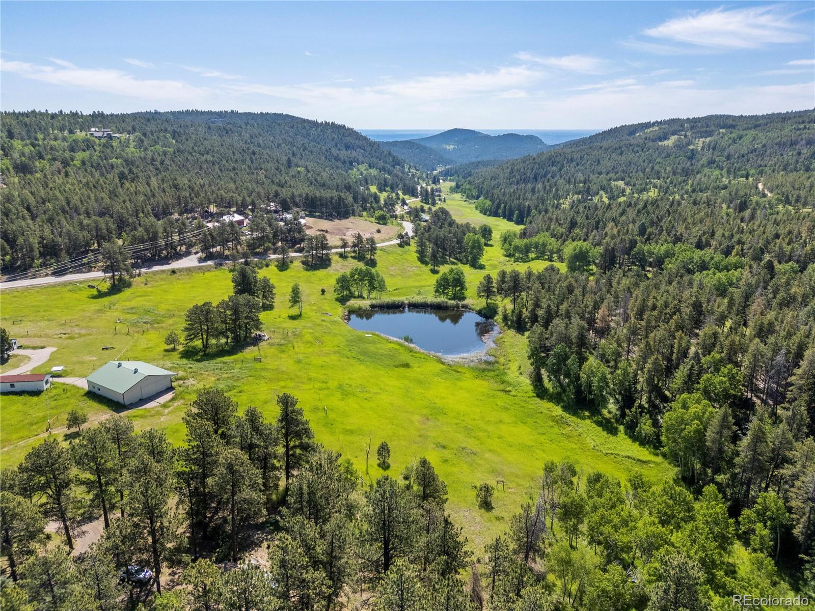21852 Pleasant Park Road Conifer, CO 80433 - Photo 5 of 47 a view of a city with mountains in the background