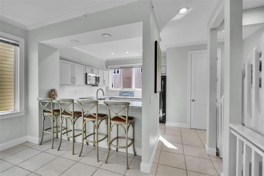 848 Evergreen Way Longboat Key, FL 34228 - Photo 5 of 66 a view of a dining room with furniture and a window