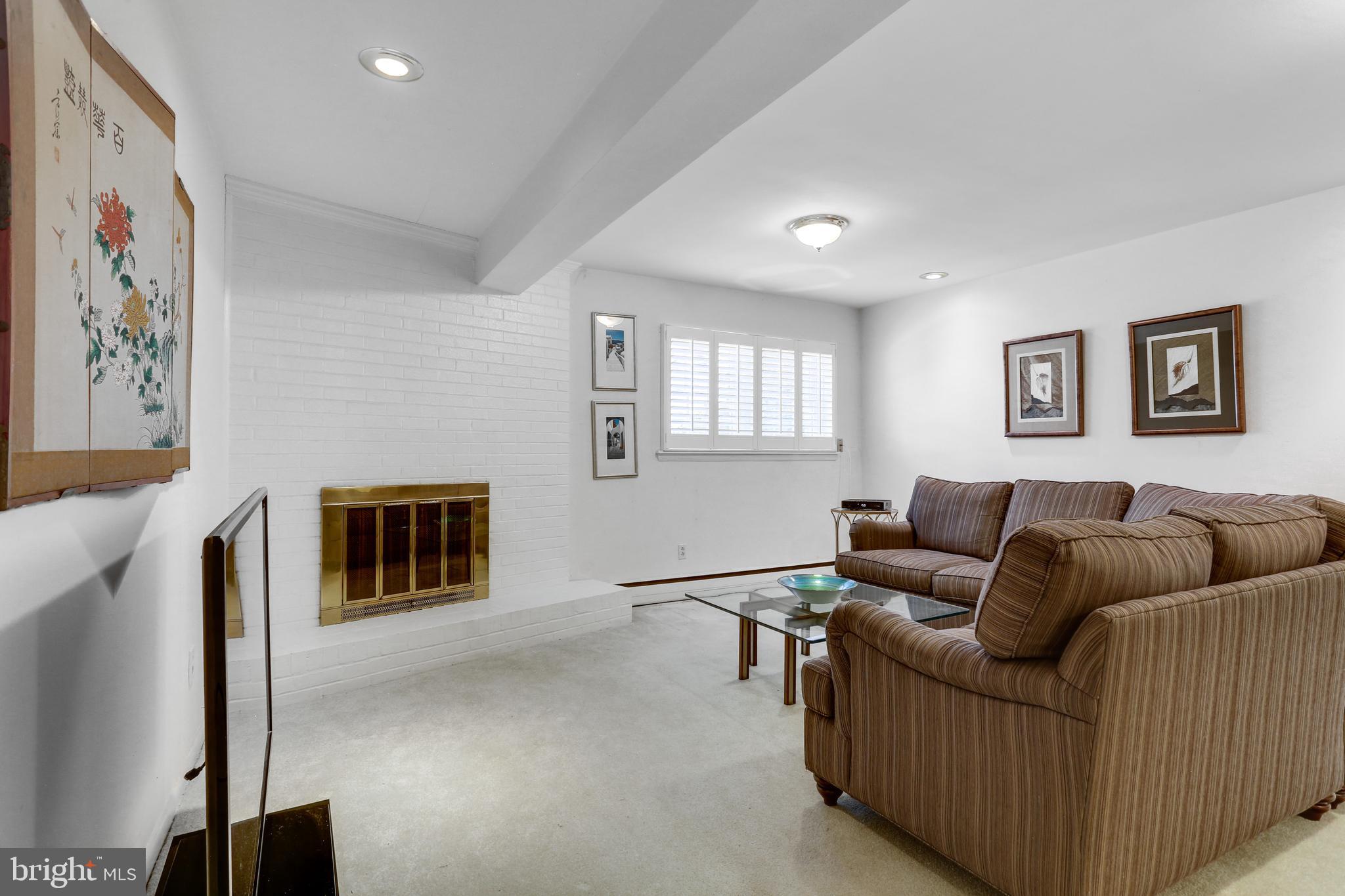 3710 Lorcom Lane Arlington, VA 22207 - Photo 13 of 48 Rec room with wood burning fireplace