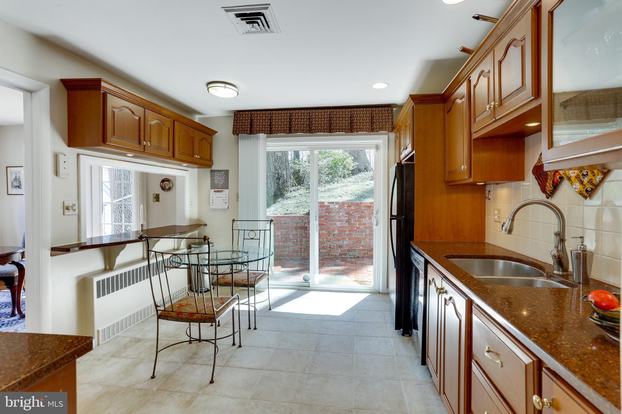 3710 Lorcom Lane Arlington, VA 22207 - Photo 41 of 48 Sliding glass doors to Georgetown brick patio